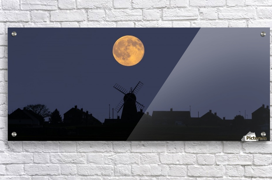 A Glowing Full Harvest Moon Over The Silhouette Of A Skyline Of Buildings Whitburn Tyne And Wear England Pacificstock